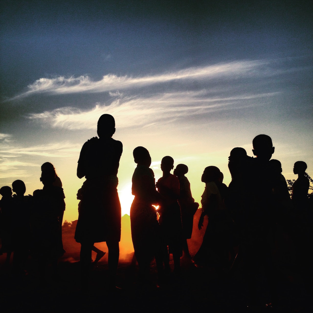 group of people at dusk